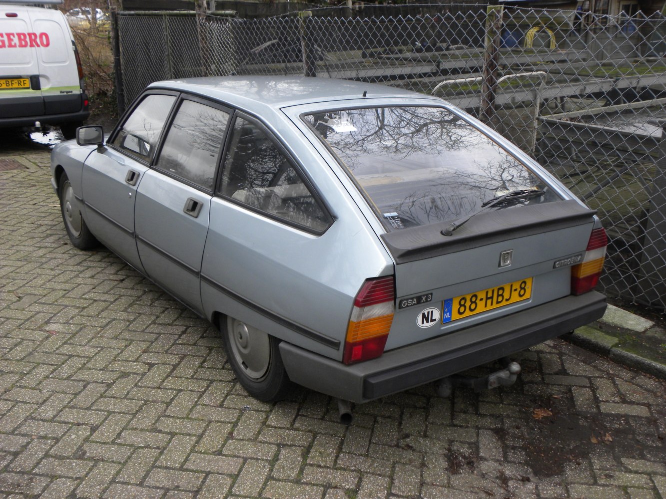 Rear hatchback side view with angular lines and silver finish
