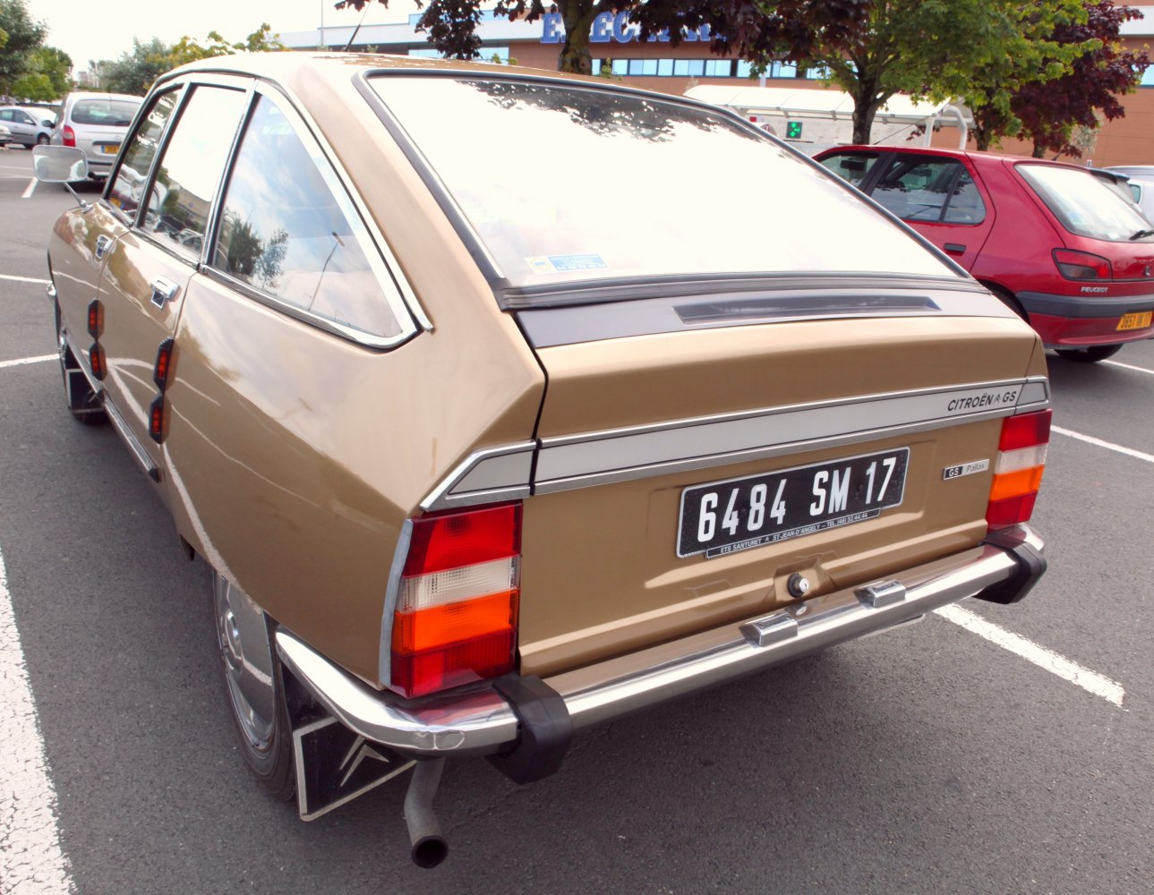 Angular classic hatchback rear and side view with chrome bumper and taillights