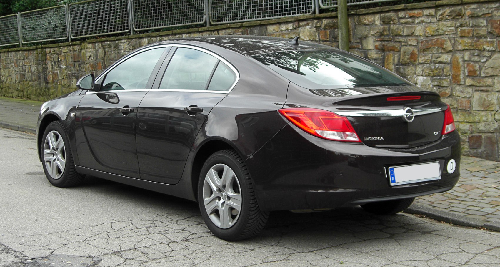 Rear view of a four-door sedan highlighting taillights and aerodynamic rear design
