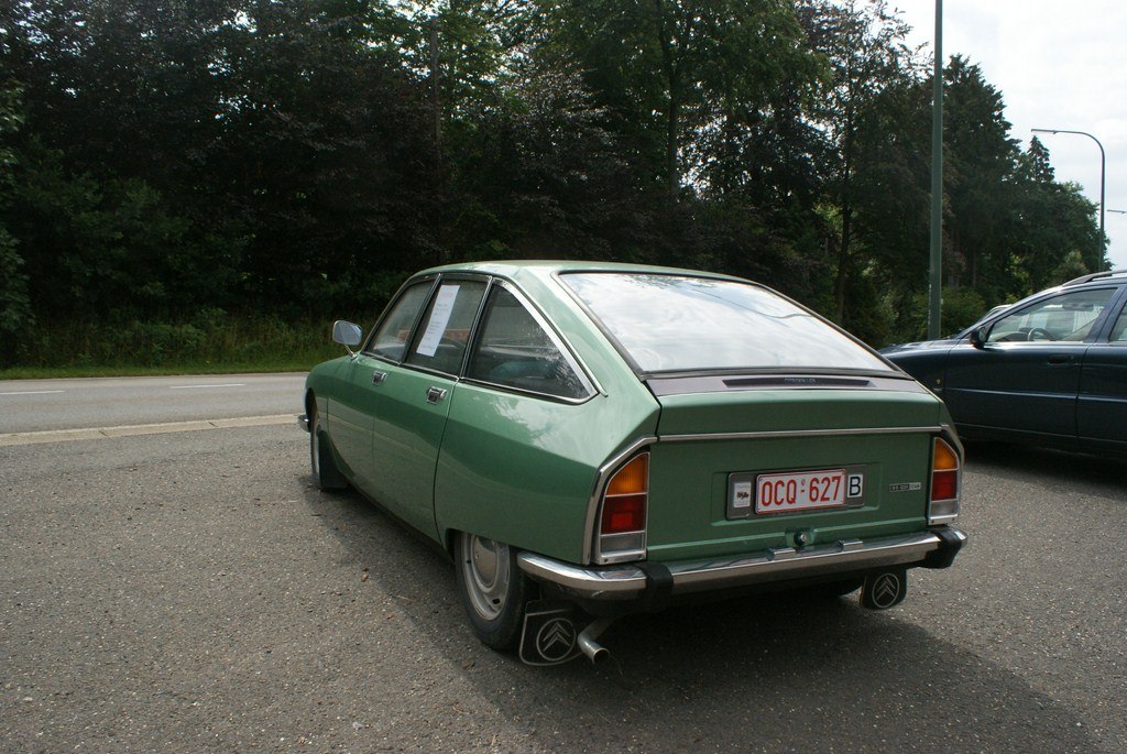 Rear view of a vintage hatchback with distinctive sloped rear windshield and tail lamp design