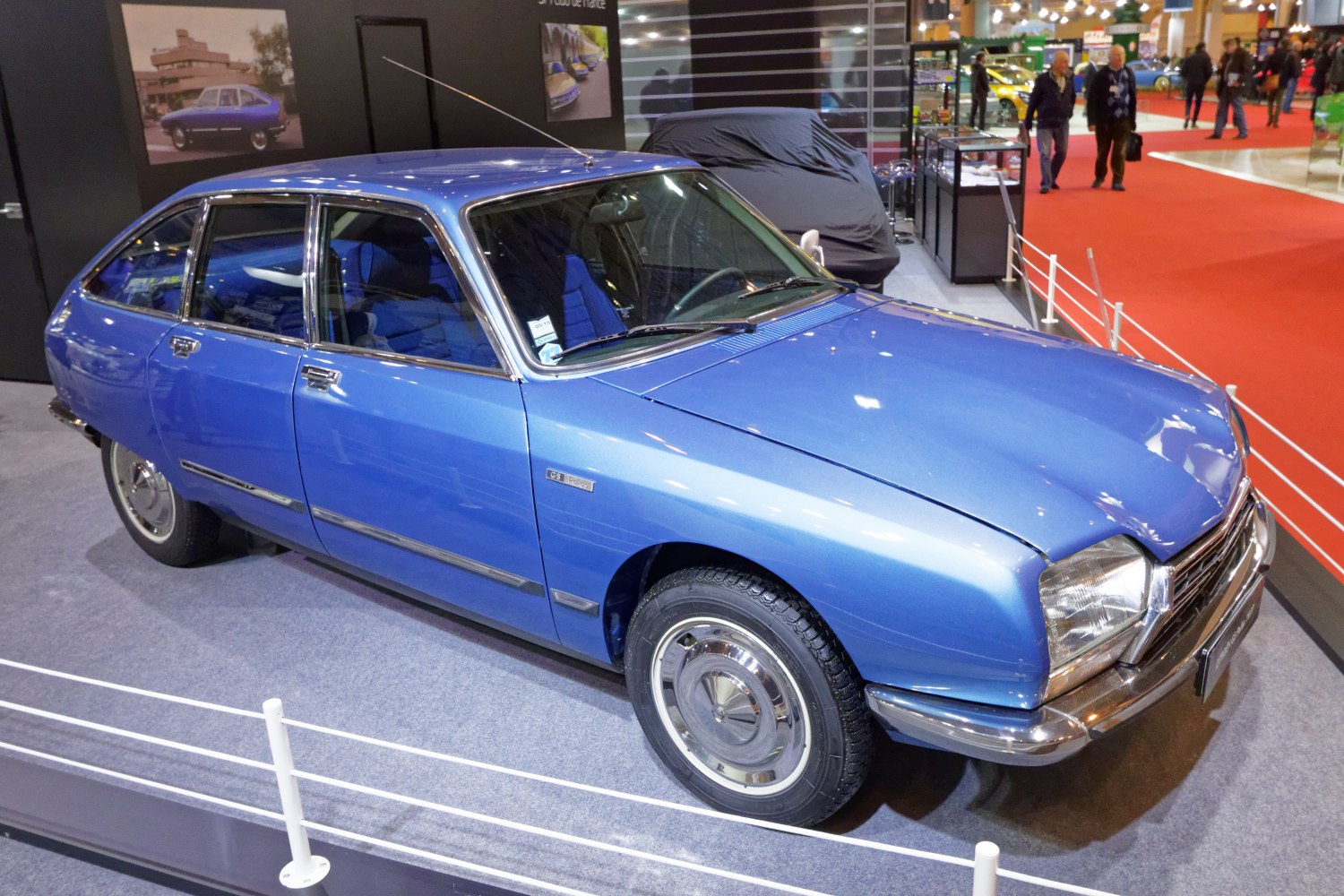 Vintage hatchback with chrome trim and classic hubcaps