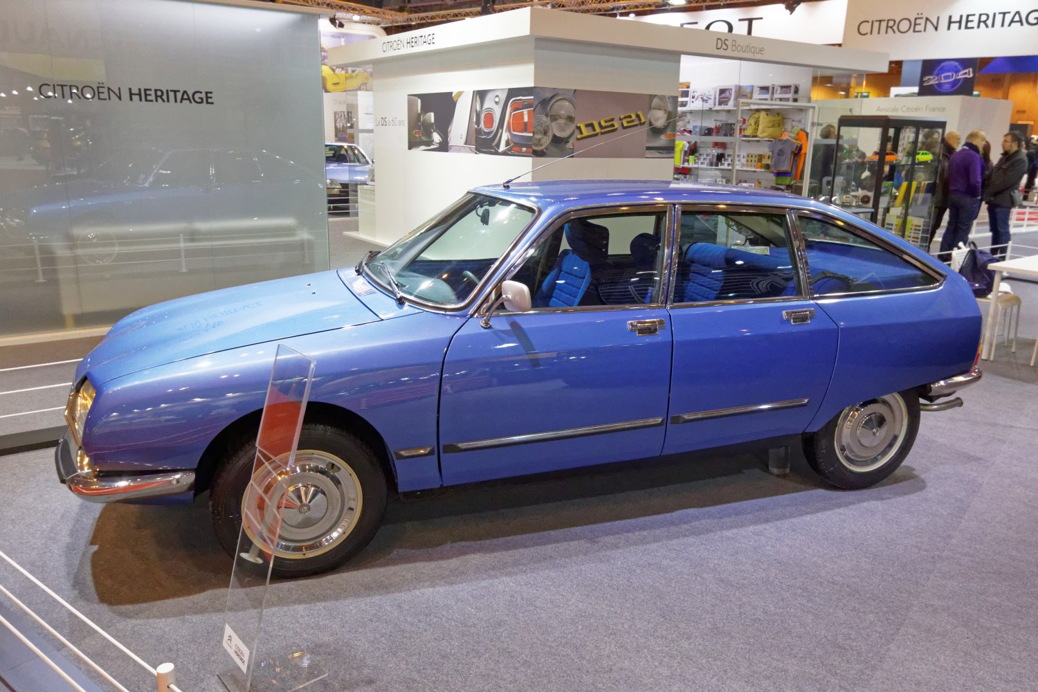 Blue vintage hatchback with angular body and unique rear window style