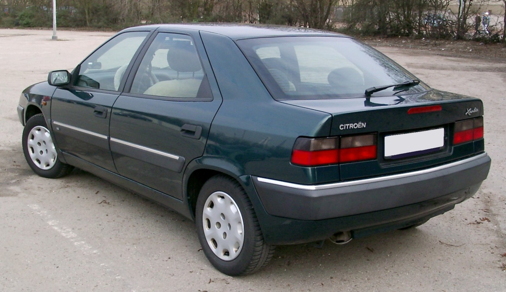 Rear and side view of a classic hatchback with distinct tail lights and clean body lines.