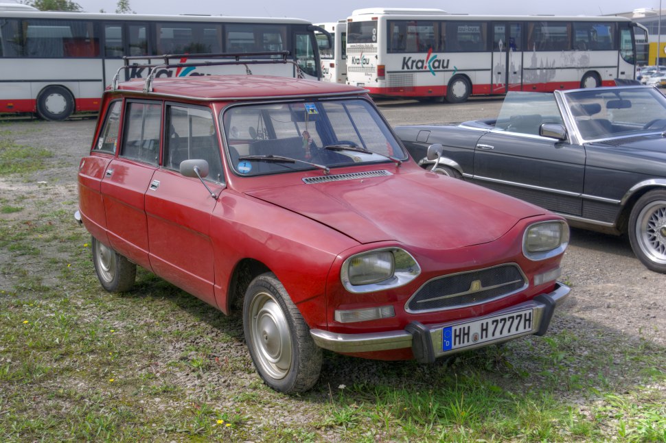 Vintage red compact hatchback with unique rectangular headlights and front grille