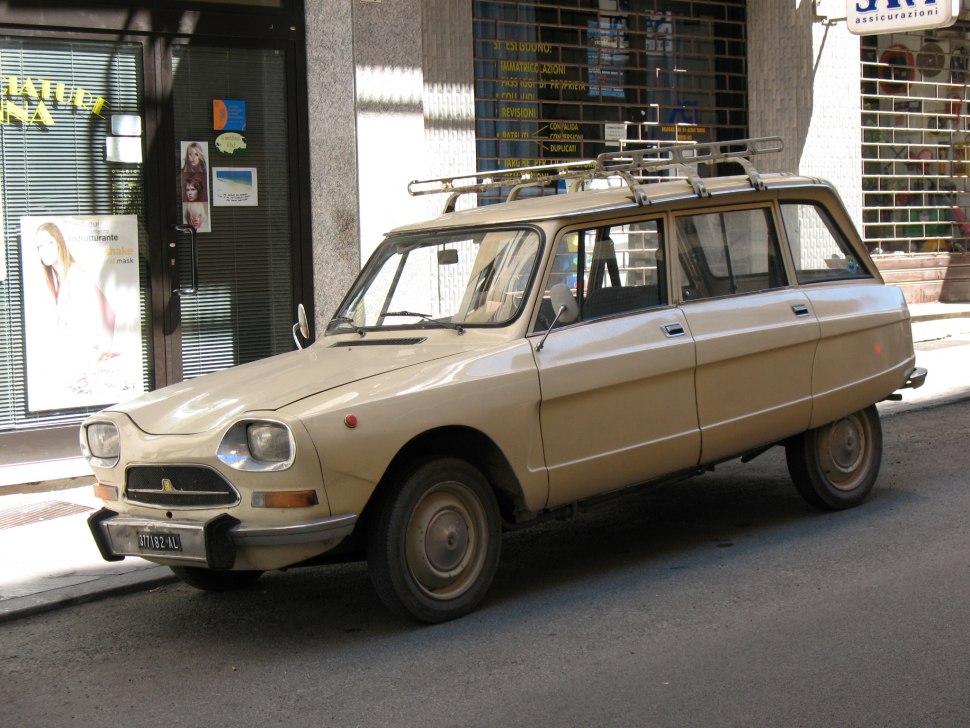 Vintage beige station wagon with multi-door and roof rack