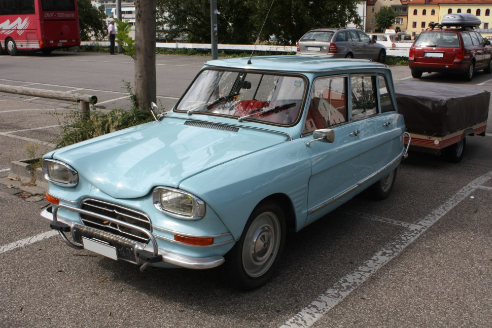 Vintage small station wagon with rectangular headlights and chrome grille