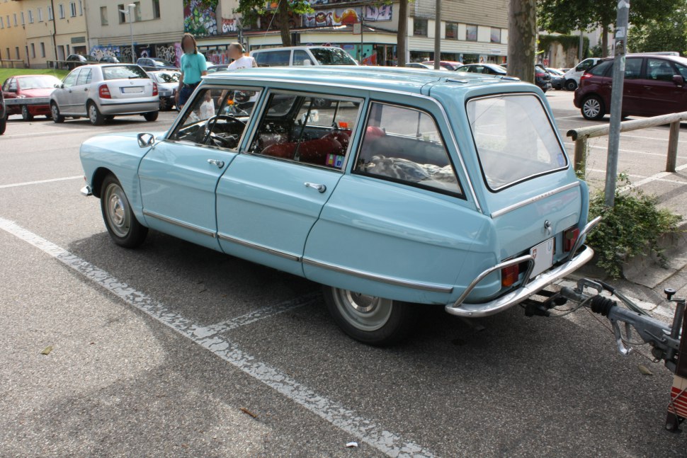 Light blue vintage station wagon with chrome bumper and rear hitch
