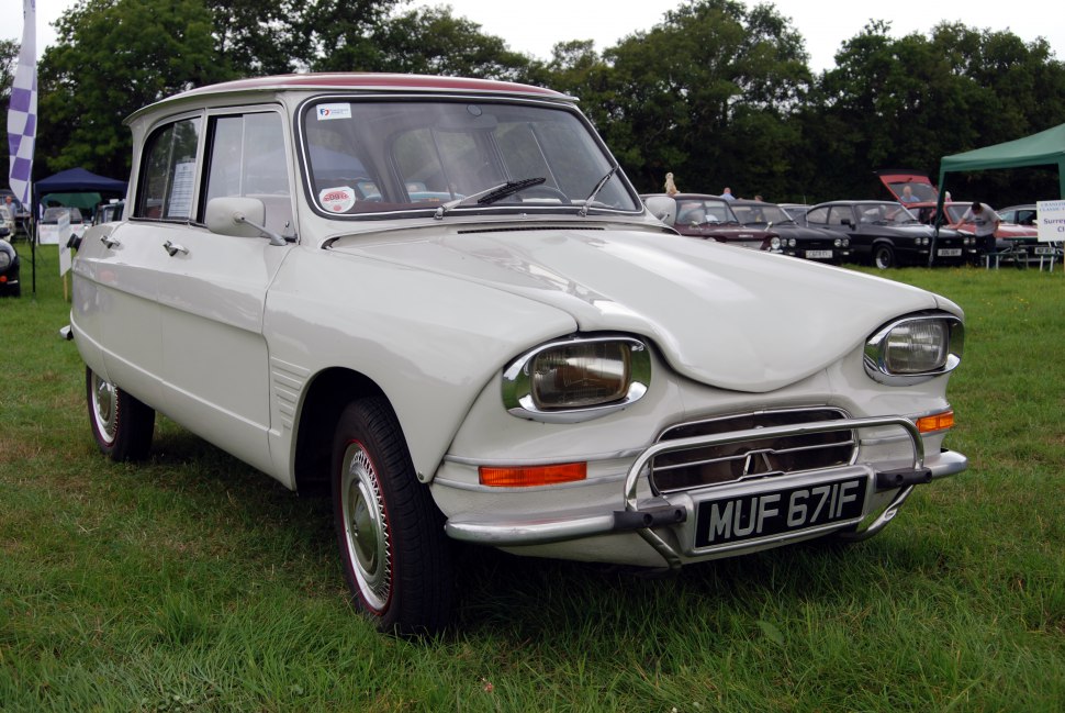 Vintage car front with unique headlights and chrome bumper