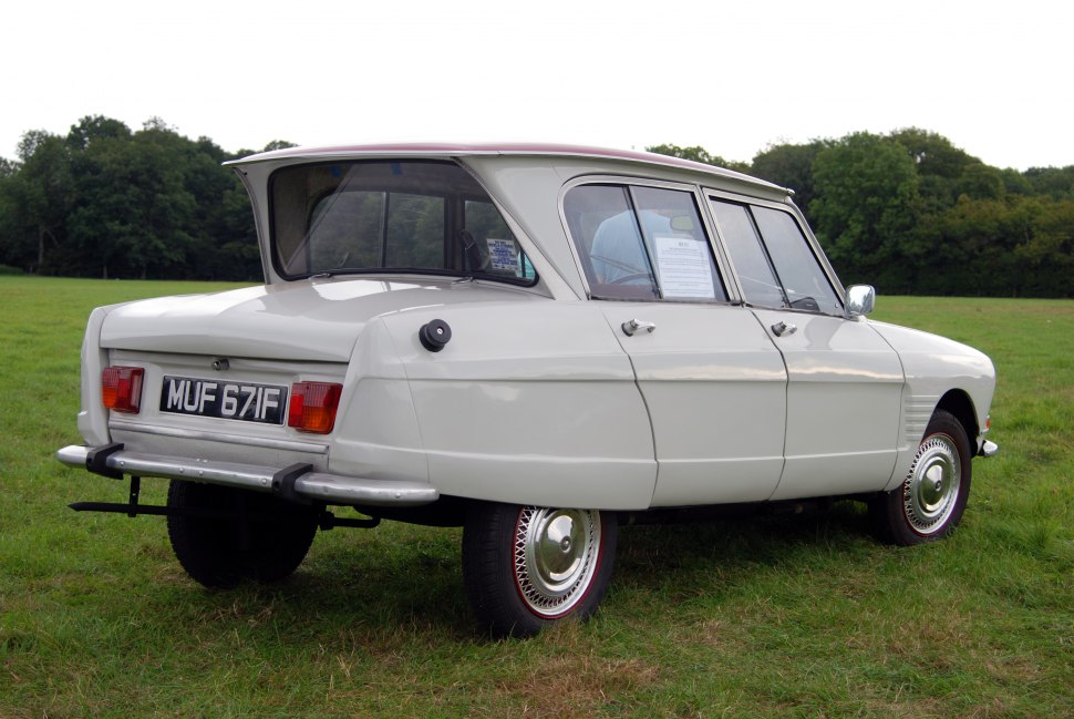 Rear side view with distinctive split rear window and vintage styling.