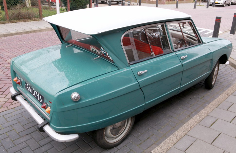 Vintage car with distinctive rear hatch and curved window design