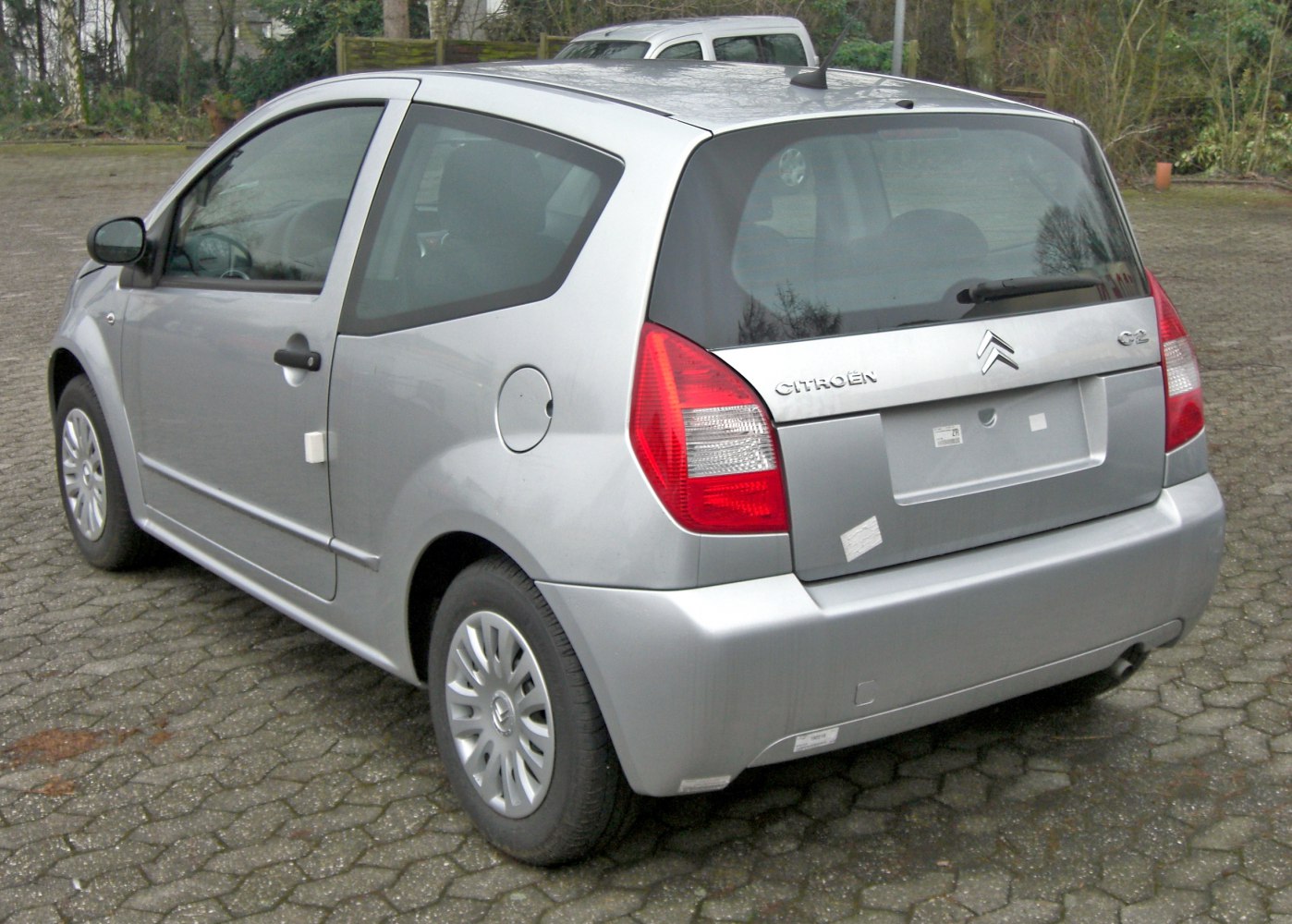 Rear view of compact hatchback with angular tail lights and smooth bumper