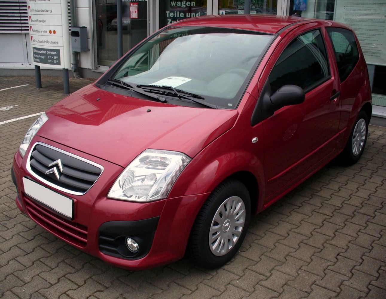 Front angled view with headlights and fog lights of a compact hatchback.