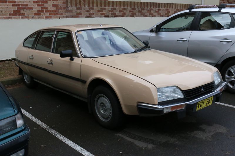 Beige classic hatchback with angular front and smooth side design
