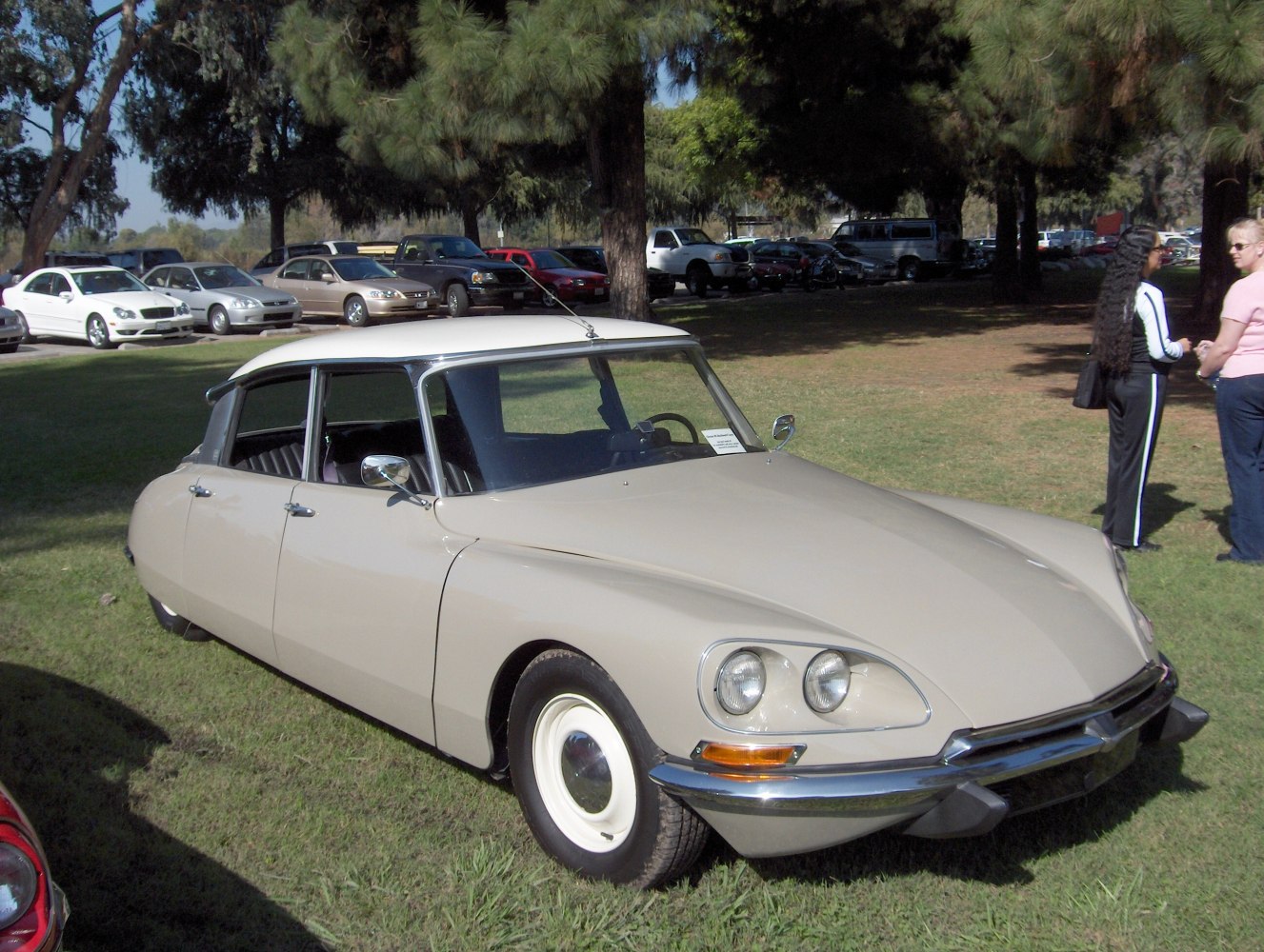 Dual front headlights and smooth, aerodynamic body design of a classic vintage sedan.