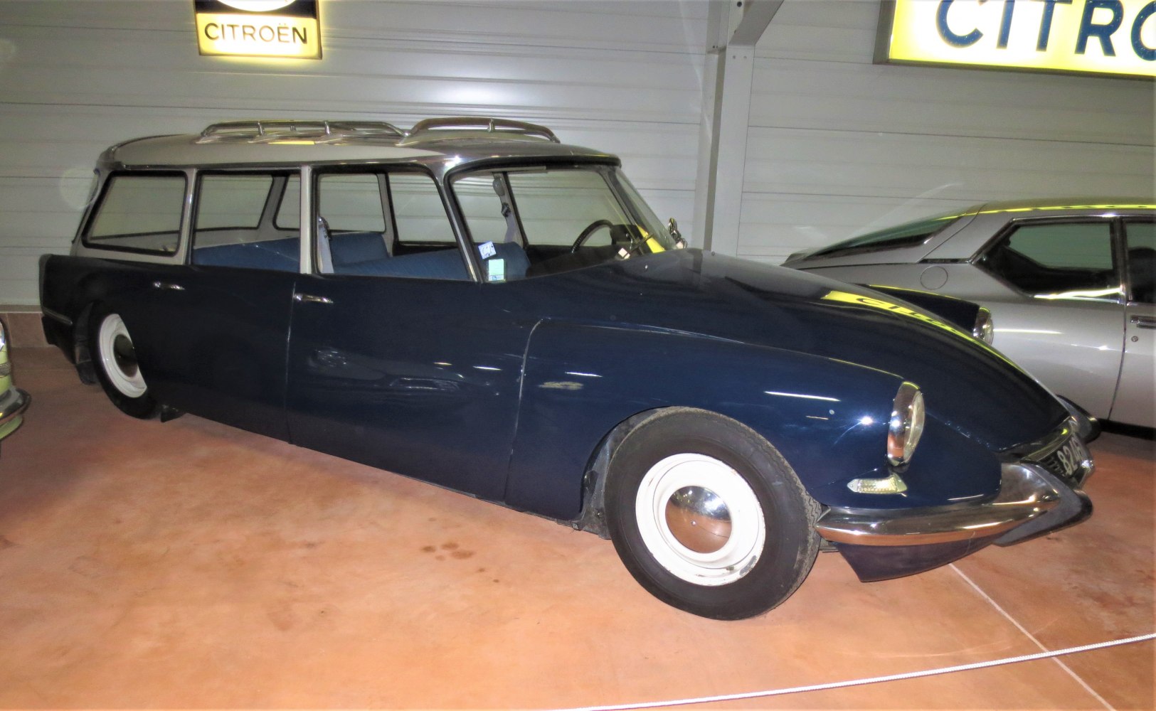Vintage station wagon side view with roof rack and retro wheels