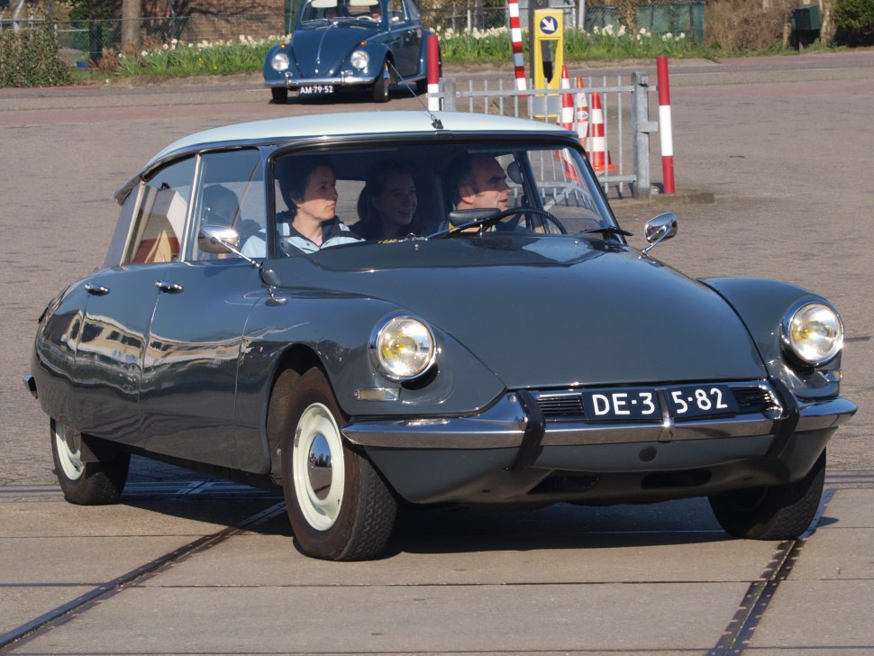 Vintage sedan with curved body and round headlights