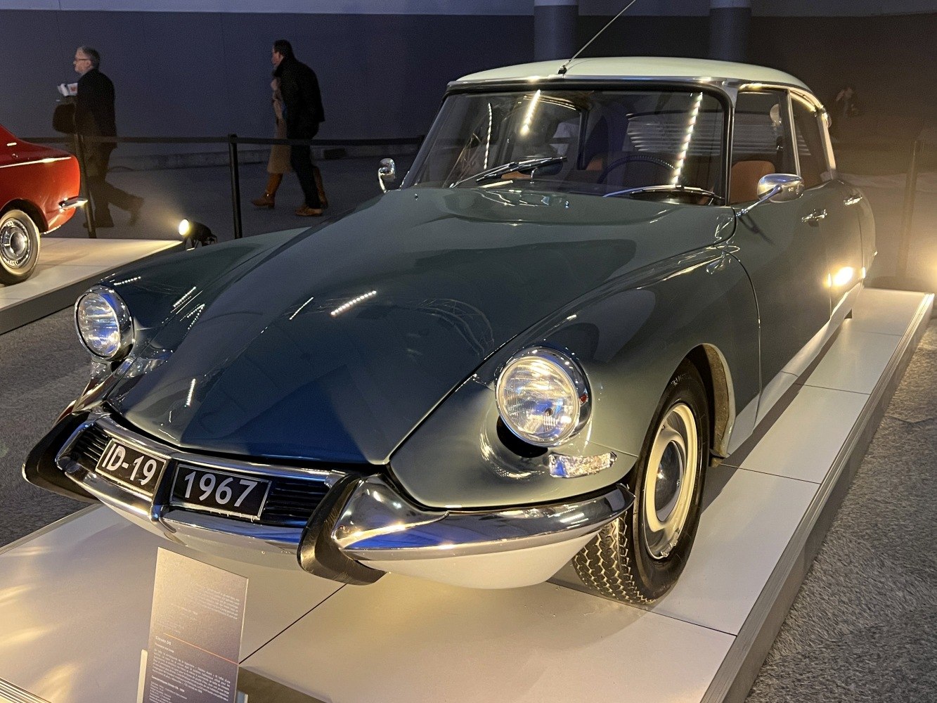 Rounded headlights and sleek body design of a vintage 1960s vehicle