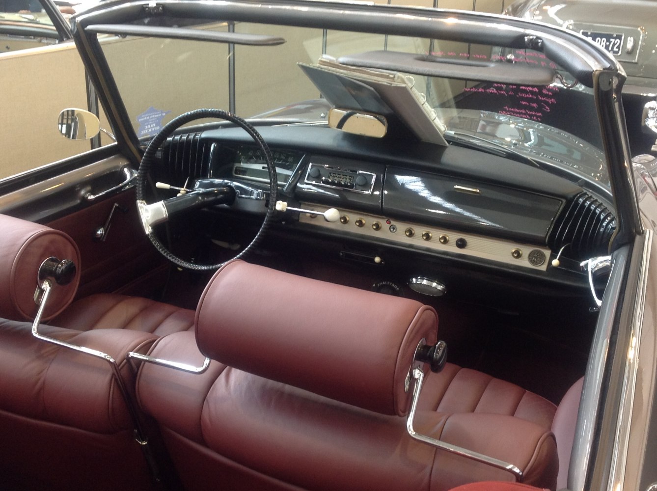 Classic Cabriolet interior with leather seats and retro dashboard.