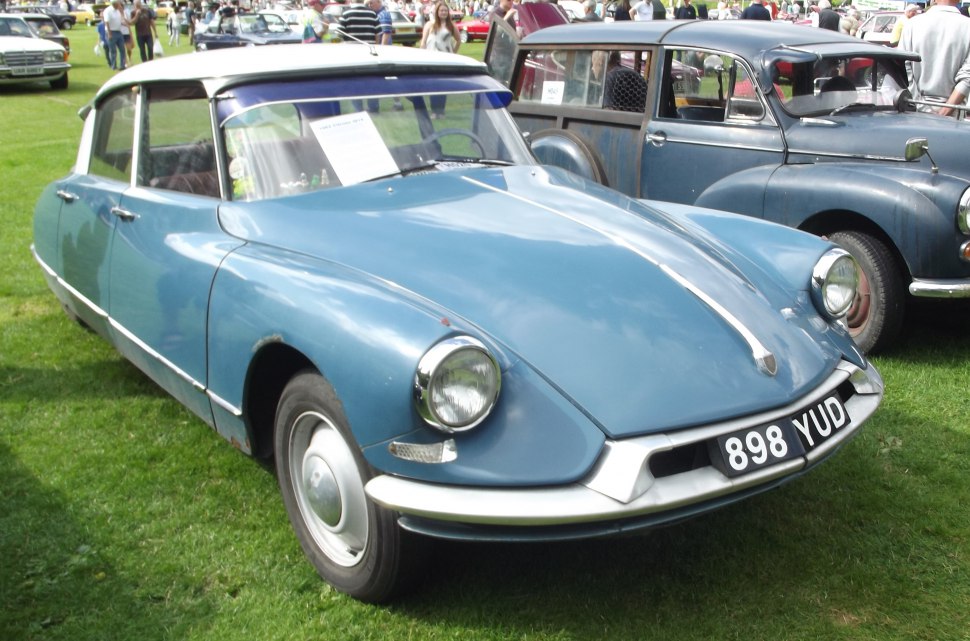 1957 classic car front with round headlamps and streamlined body