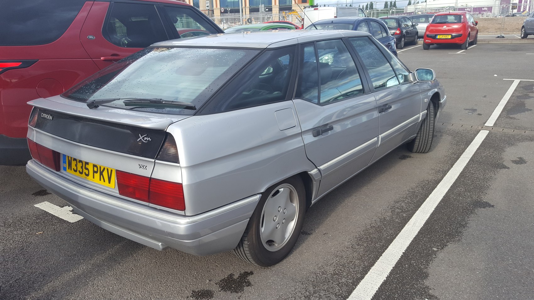 Silver aerodynamic hatchback rear and side view