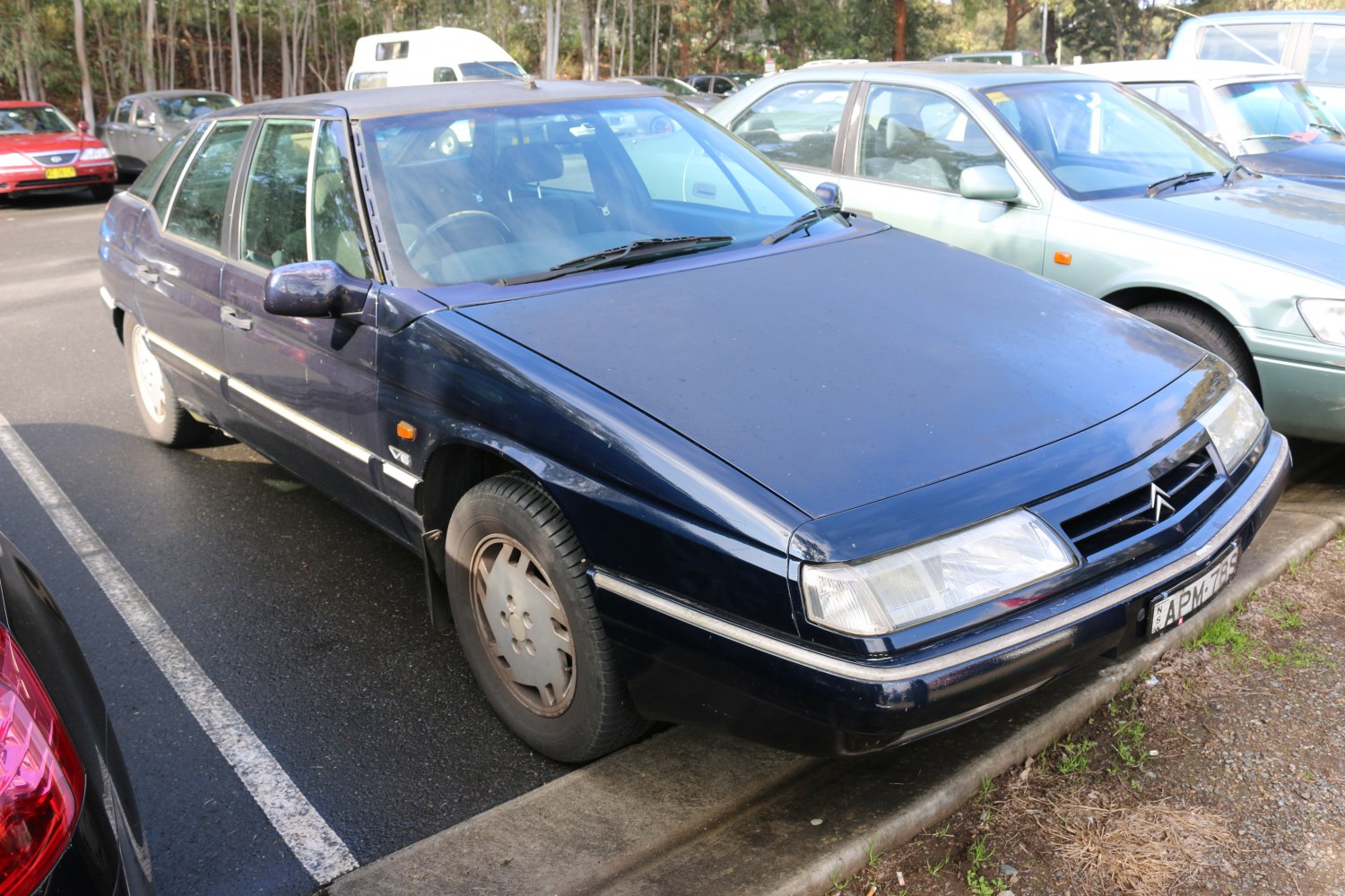 Angular headlights and classic sedan front side profile in mid-90s style