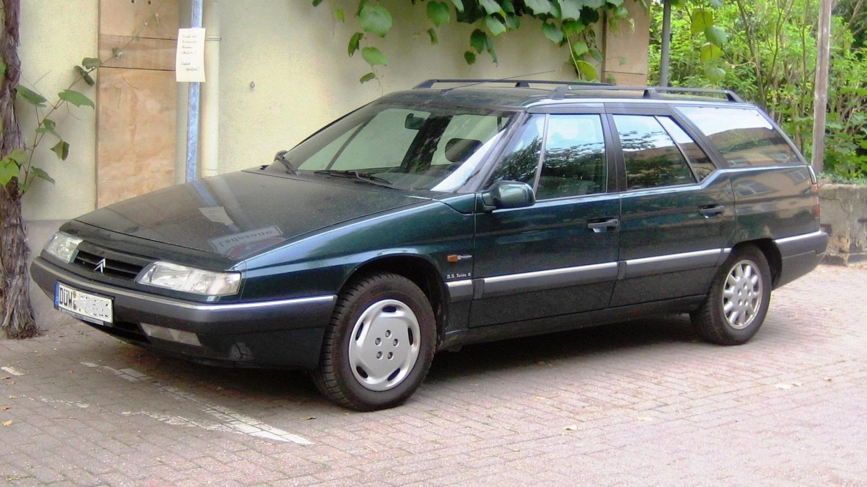 Angular 1990s station wagon front-side view and profile