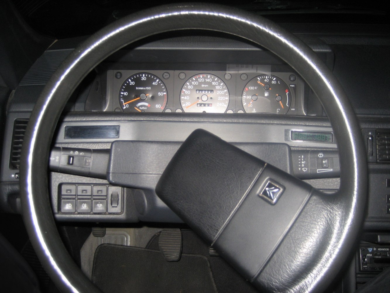 Steering wheel with classic instrument gauges and control buttons