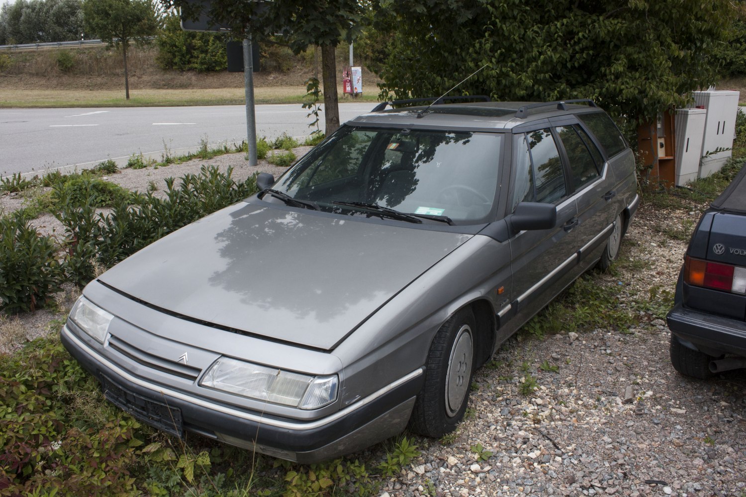 Angular front, covered wheels, station wagon profile