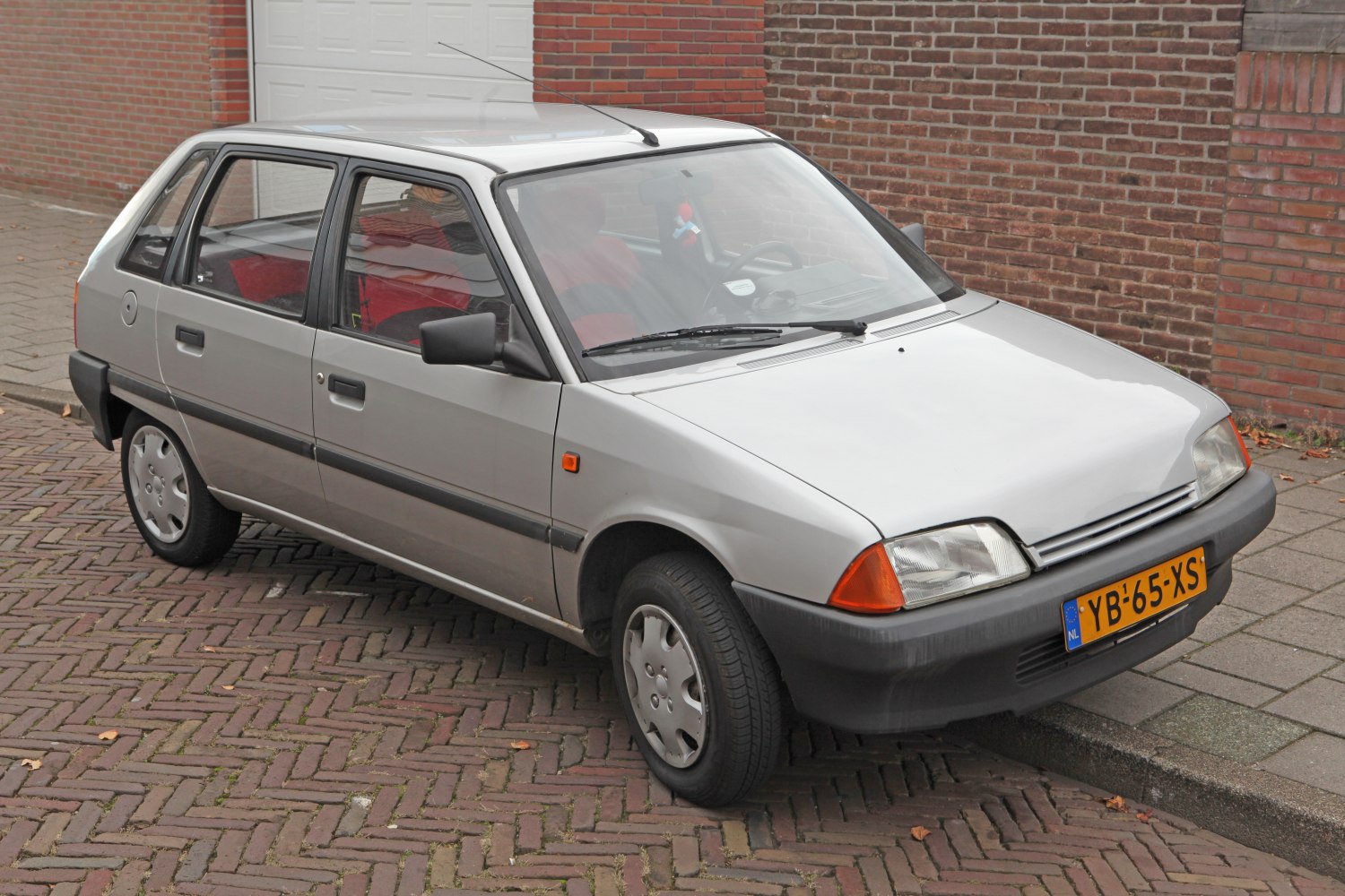 Classic compact hatchback with angular design and black bumpers