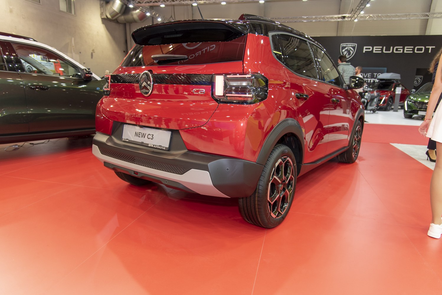 Rear view of a hatchback with modern tail lights and black roof