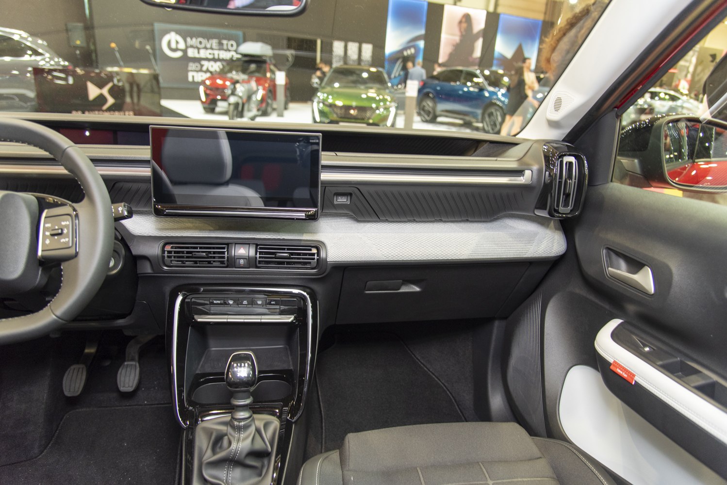 Modern dashboard with touchscreen and manual gear shift