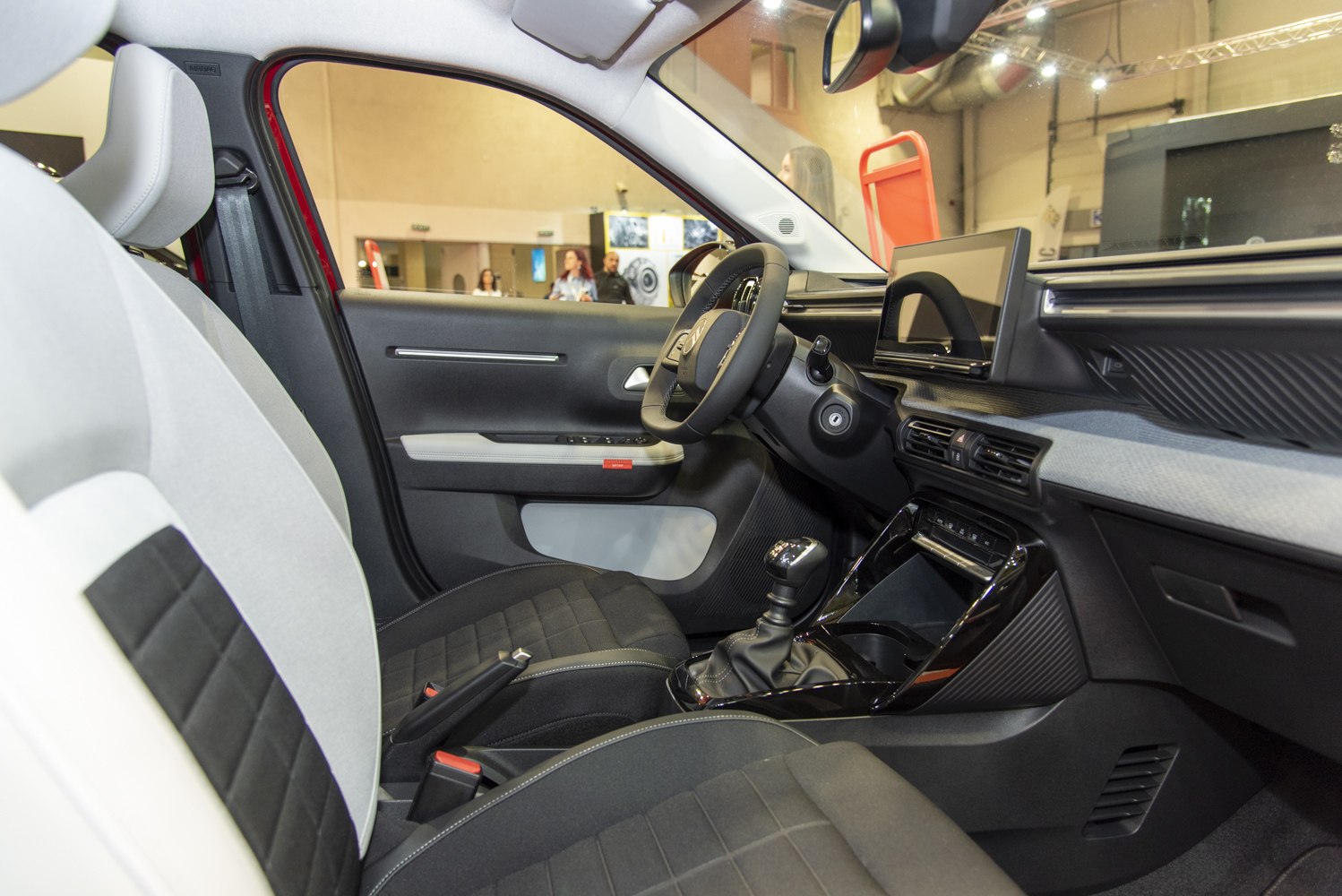 Modern car interior with manual transmission and touchscreen display