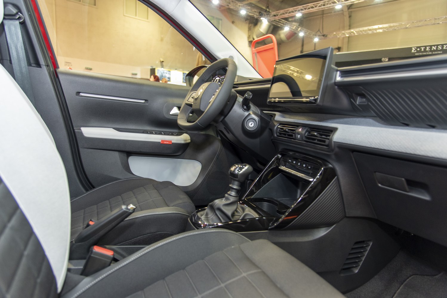 Car interior with digital dashboard and manual transmission
