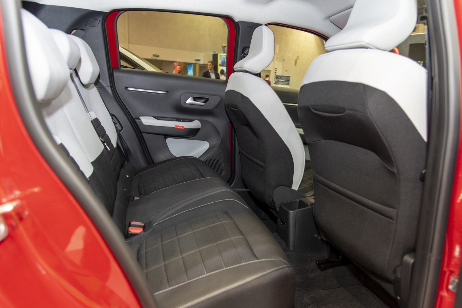 Spacious rear seat with modern two-tone upholstery and door panel design