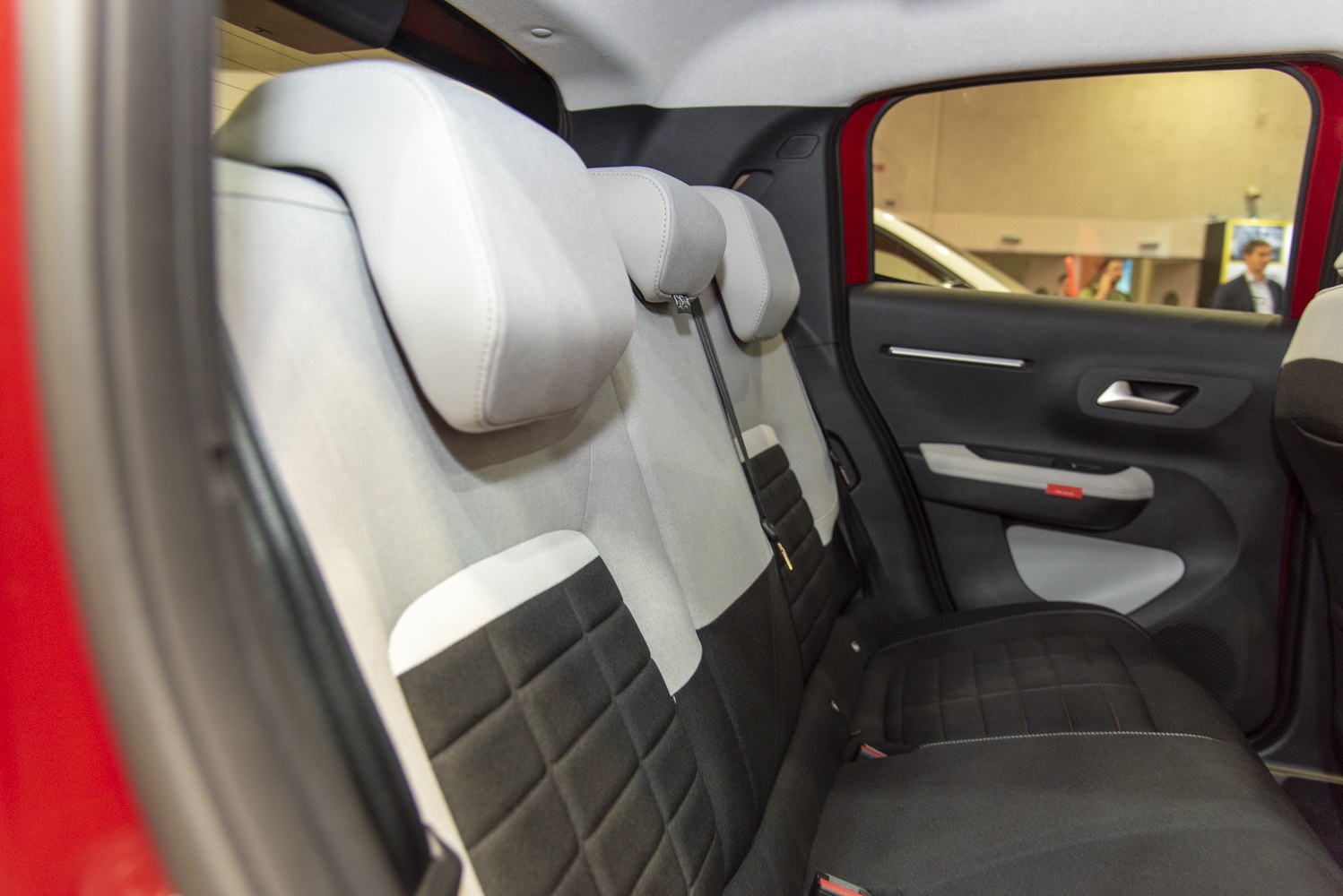 Rear seats with integrated headrests and door panel interior.