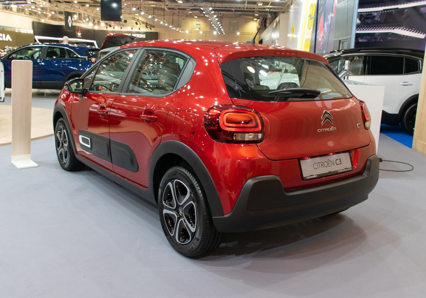 Rear and side view of hatchback with unique tail lights and black body cladding