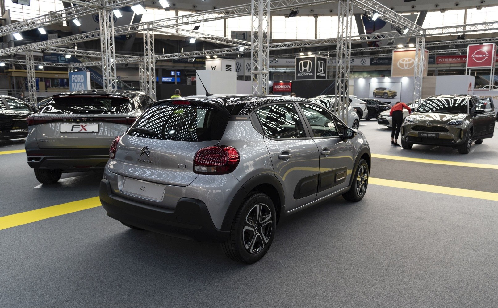 Rear and side profile of a compact hatchback with distinct taillights and two-tone detailing