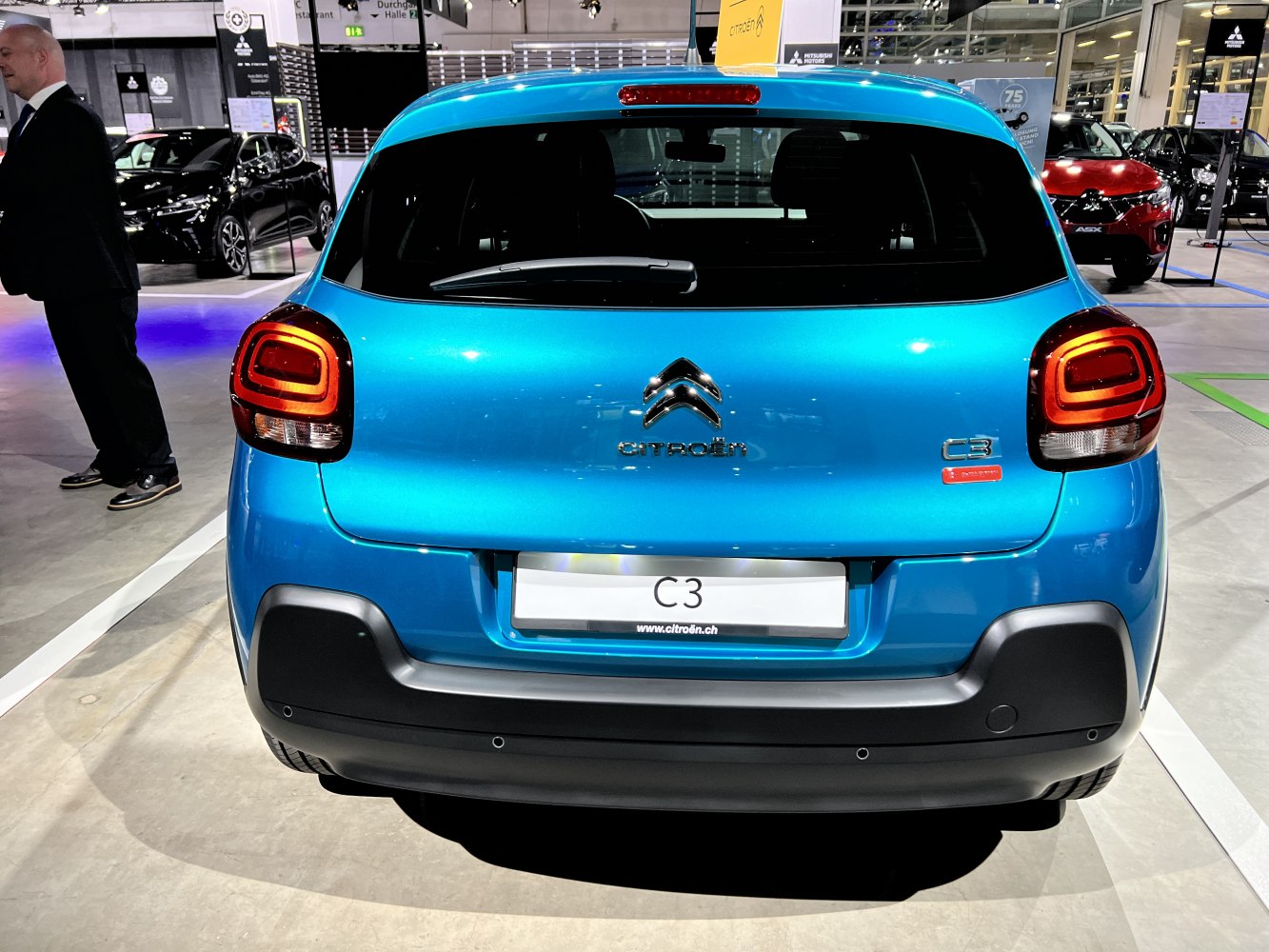 Rear view of compact hatchback with distinct taillights and rear bumper