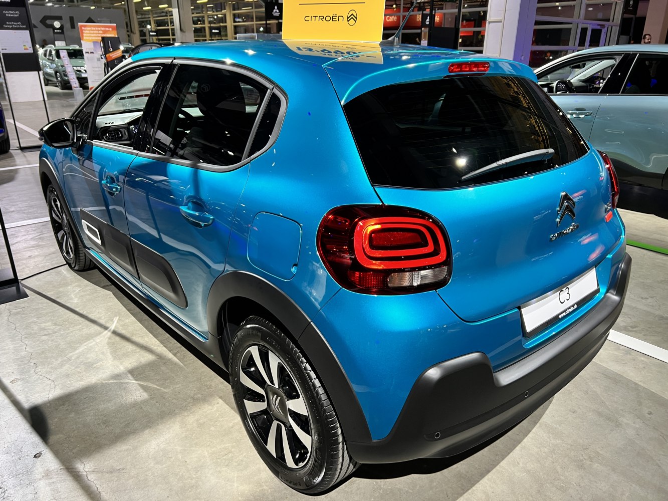 Compact hatchback with distinctive rear LED lights and black protective accents