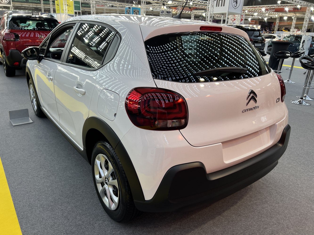 Rear view of a compact hatchback with distinctive tail lights