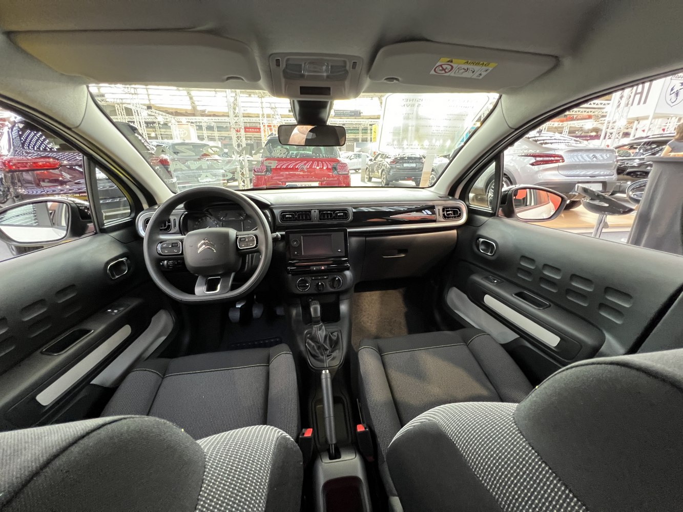 Dashboard layout and steering wheel with control buttons