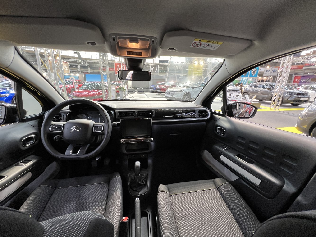 Modern car interior with dashboard and steering wheel