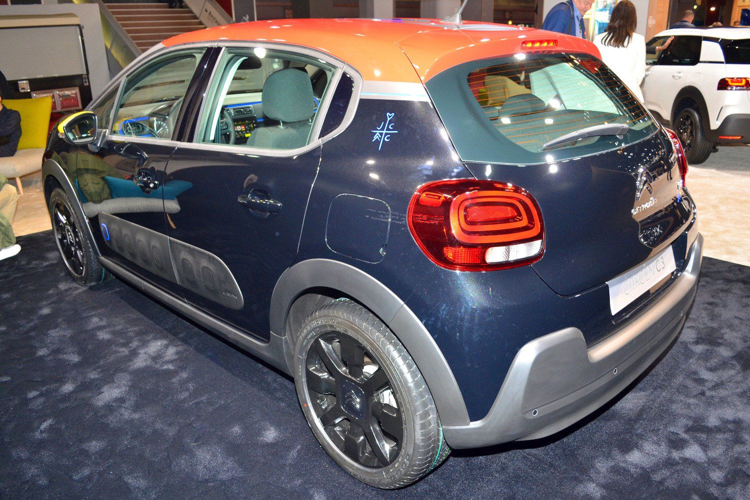 Rear view of hatchback with distinctive door panels and black wheels