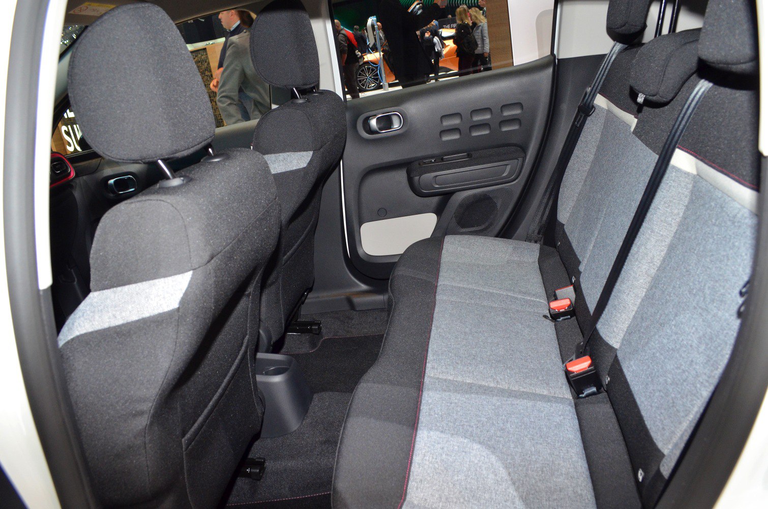 Rear passenger seats with fabric upholstery and door panel detail
