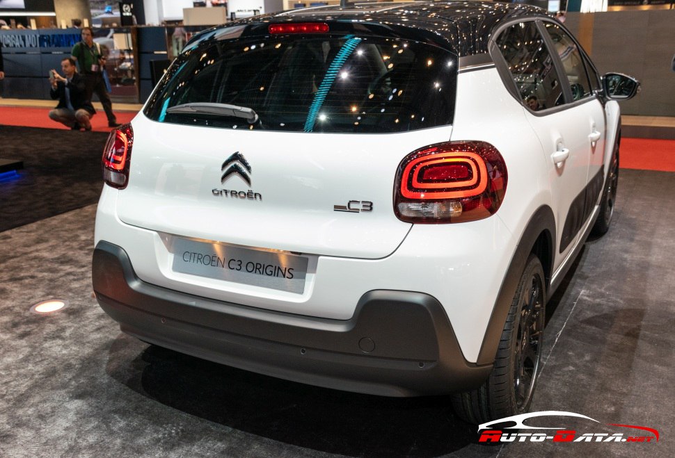 Rear view with distinctive taillights and black contrasting roof.