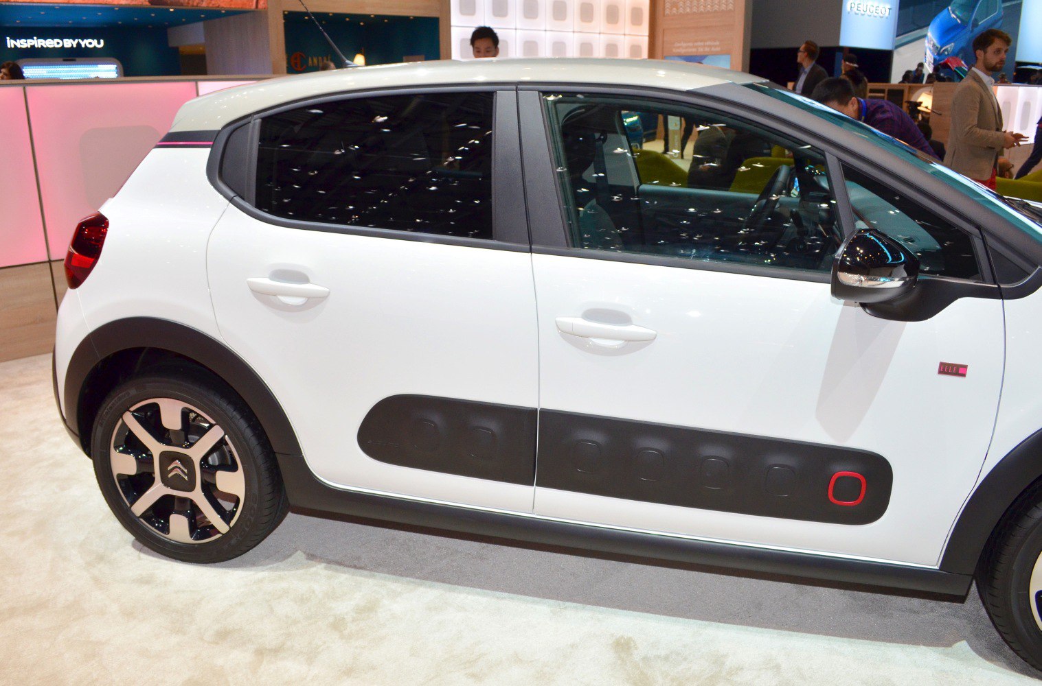 Side view of compact hatchback with black Airbump panels and alloy wheels