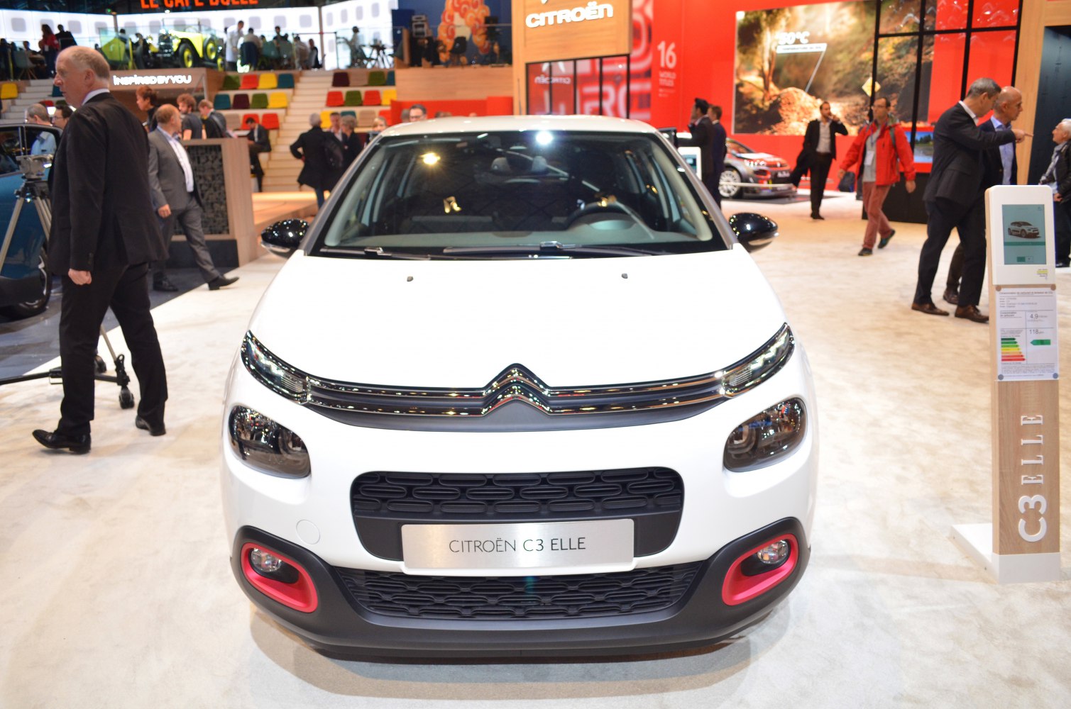 Front view with slim headlights, distinct grille, and red-accent fog light housings