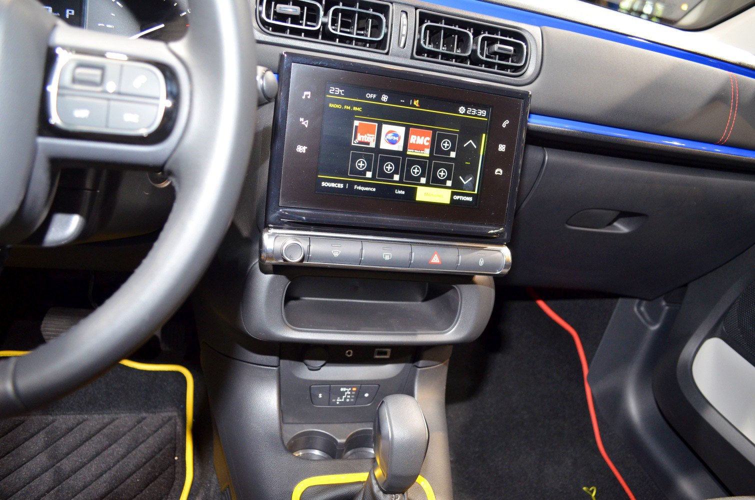 Touchscreen infotainment and control panel in car interior