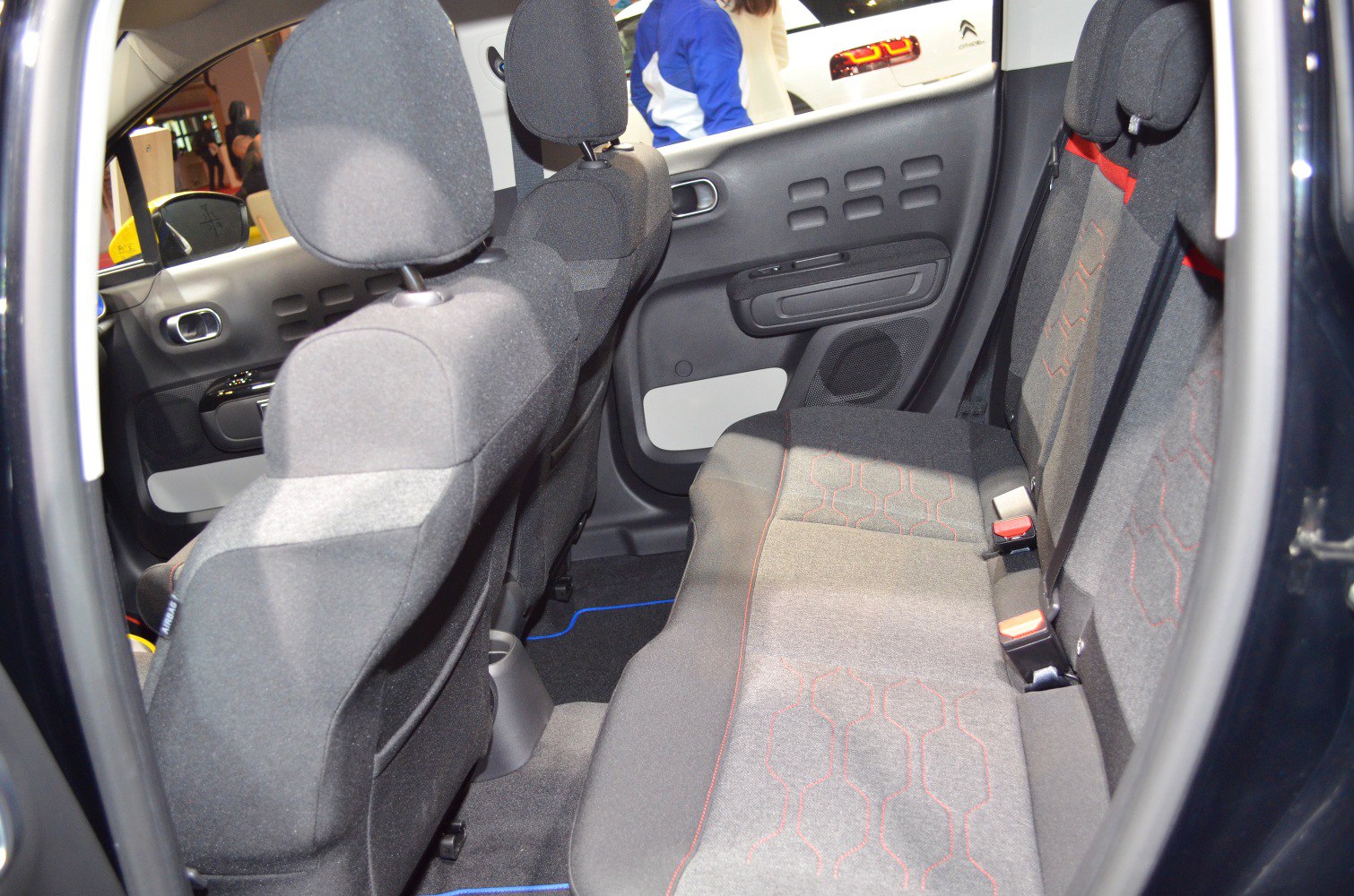 Rear seat fabric upholstery and door panel interior of compact vehicle