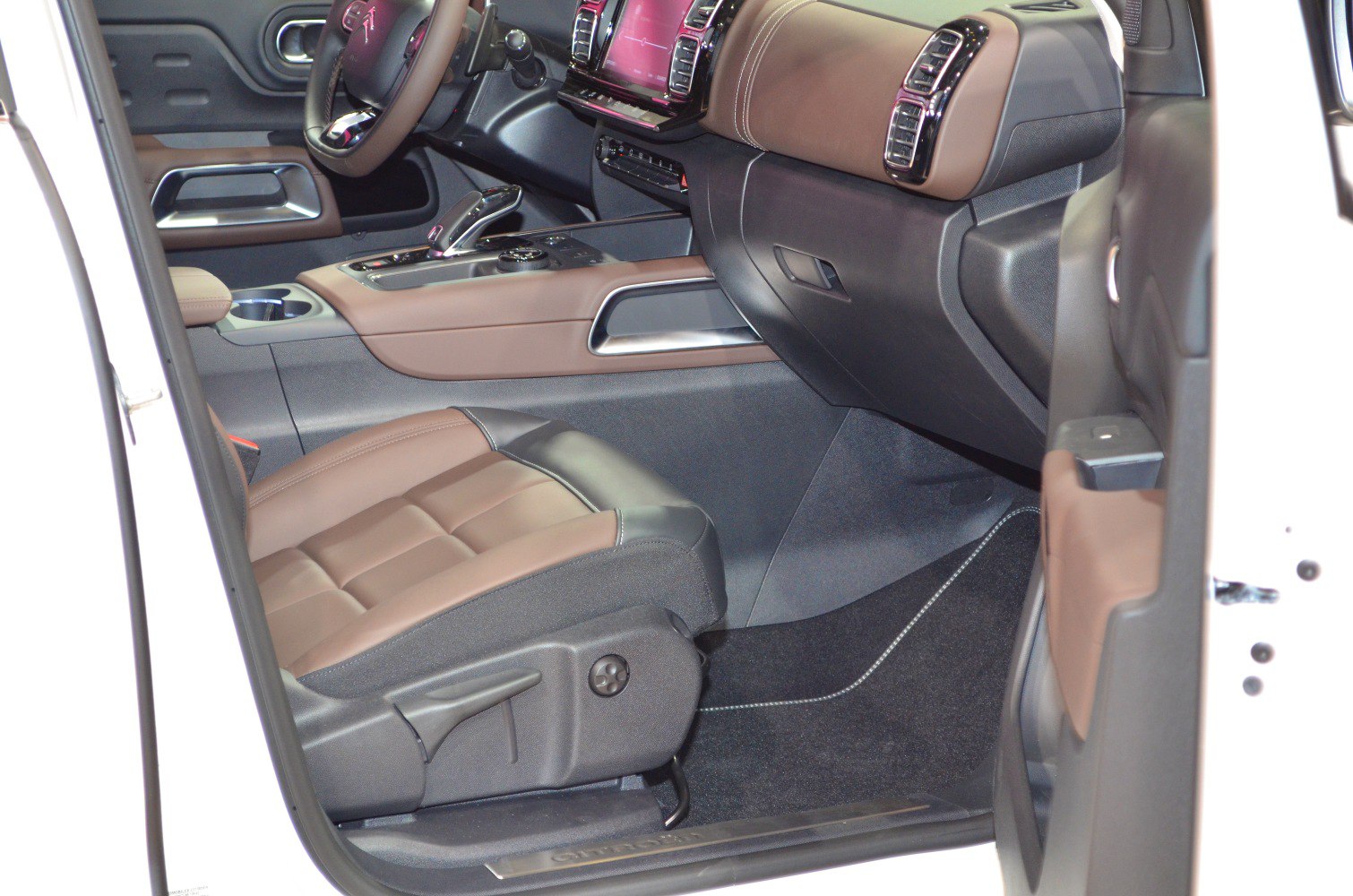 Brown and black leather seats with dashboard and gear shifter